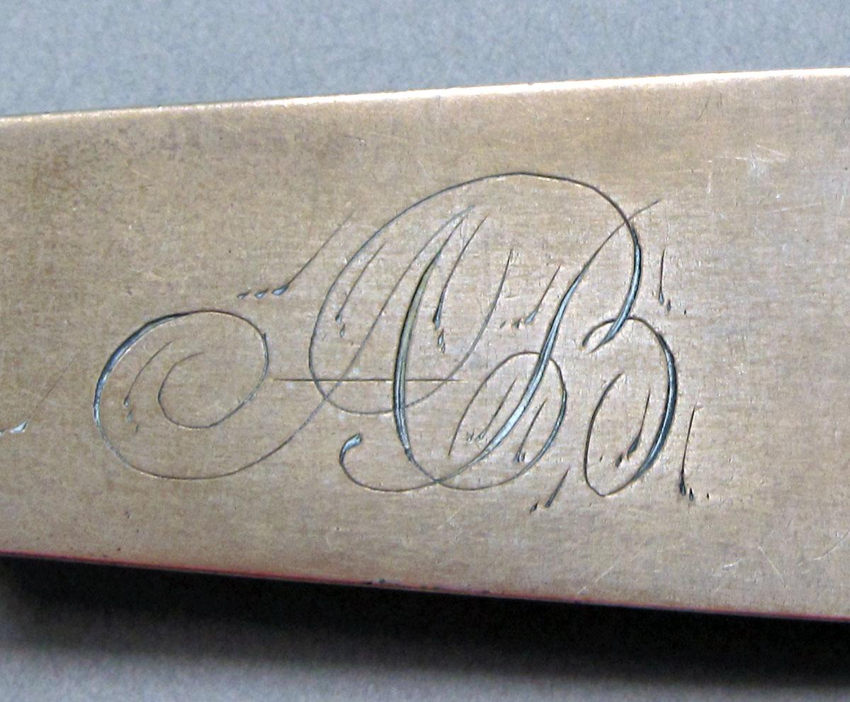 1962.0240.1458 Silver spoon engraving