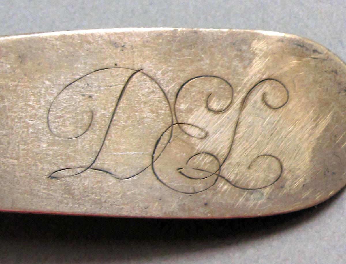1962.0240.1466 Silver spoon engraving