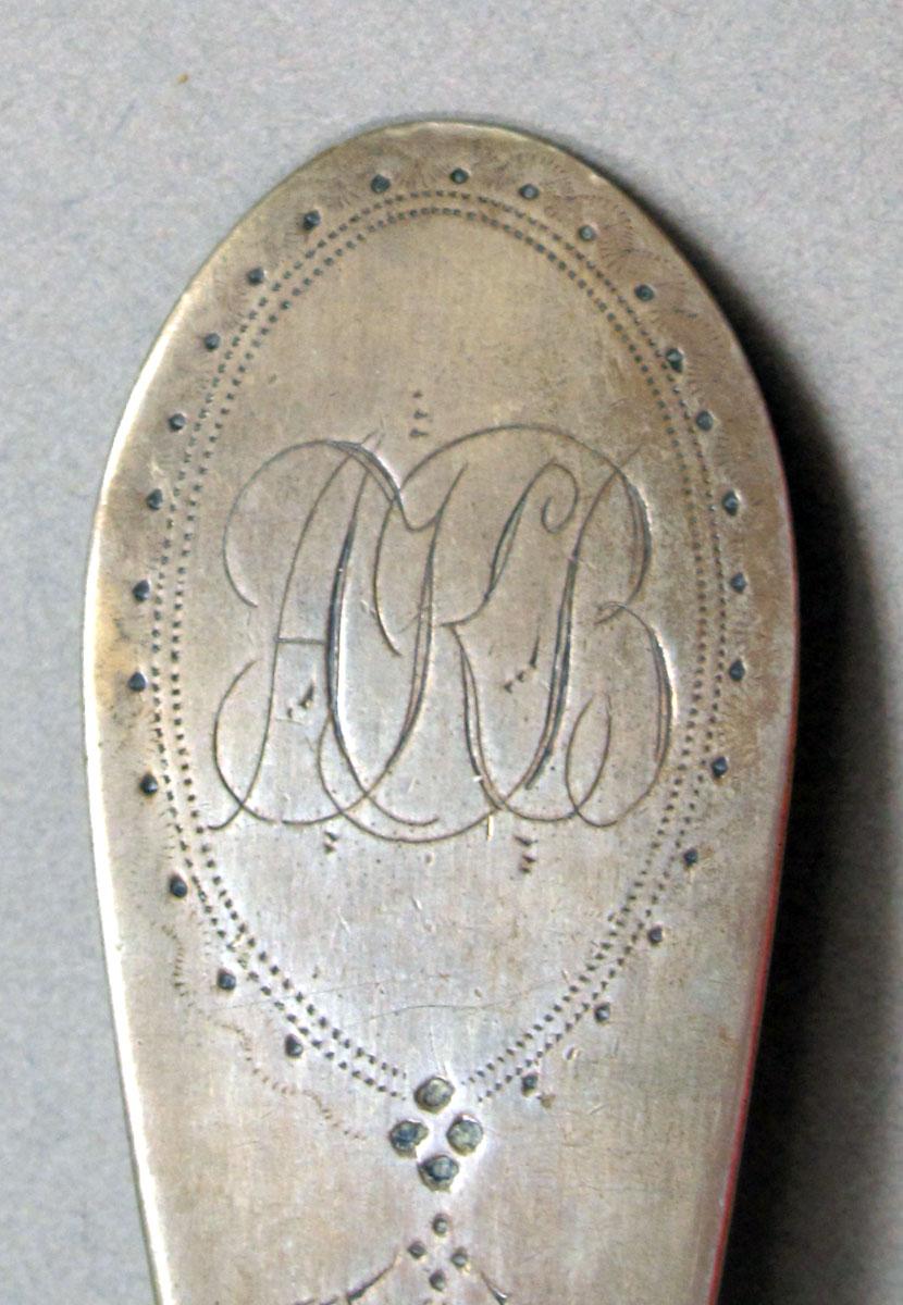 1962.0240.1468 Silver spoon engraving