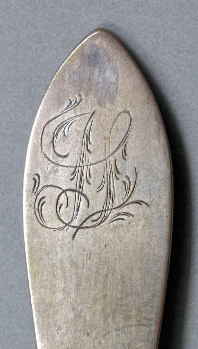 1962.0240.1476 Silver spoon engraving