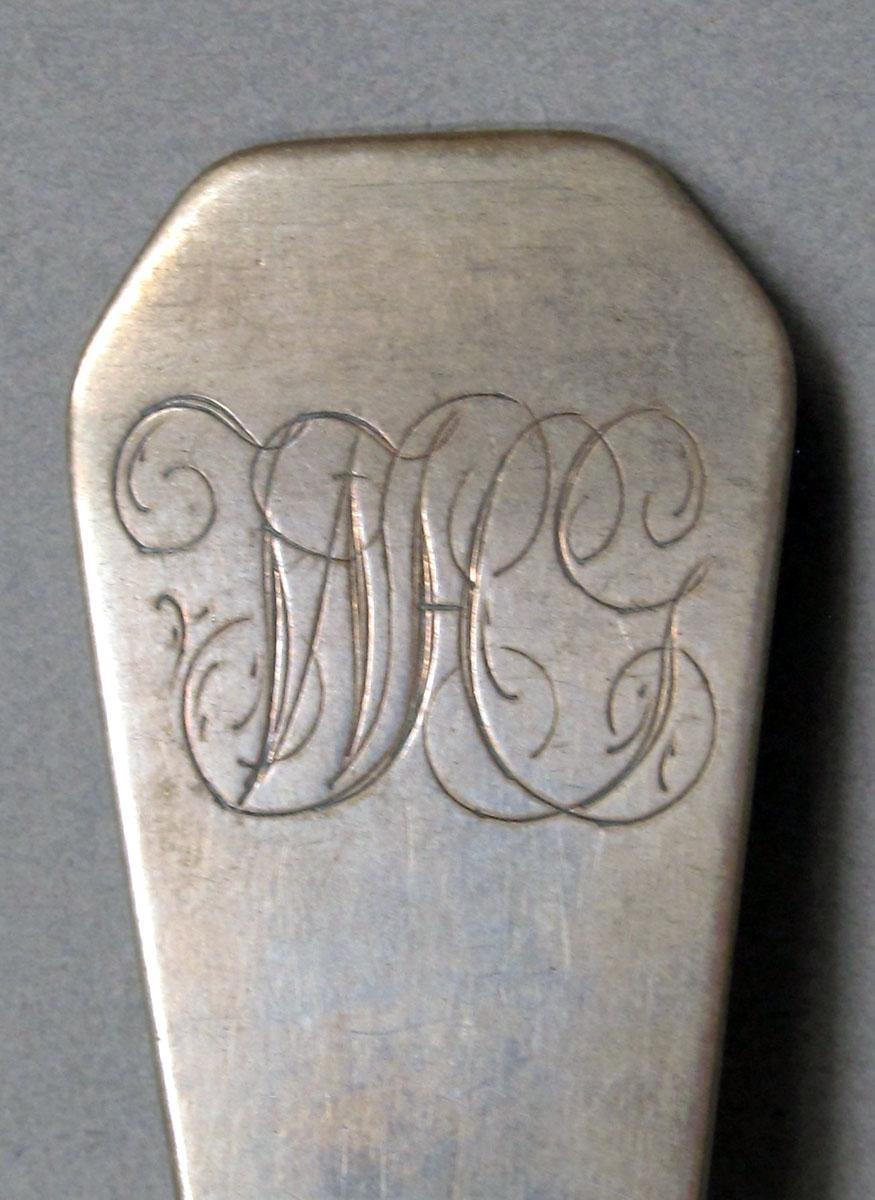1962.0240.1484 Silver spoon engraving