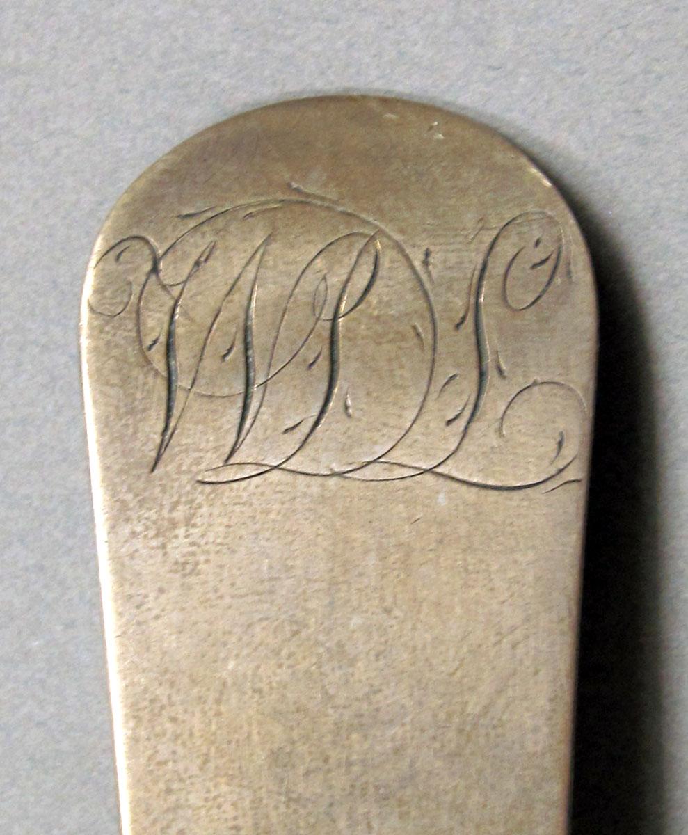 1962.0240.1486 Silver spoon engraving