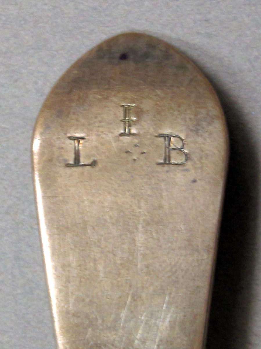 1962.0240.1492 Silver spoon engraving