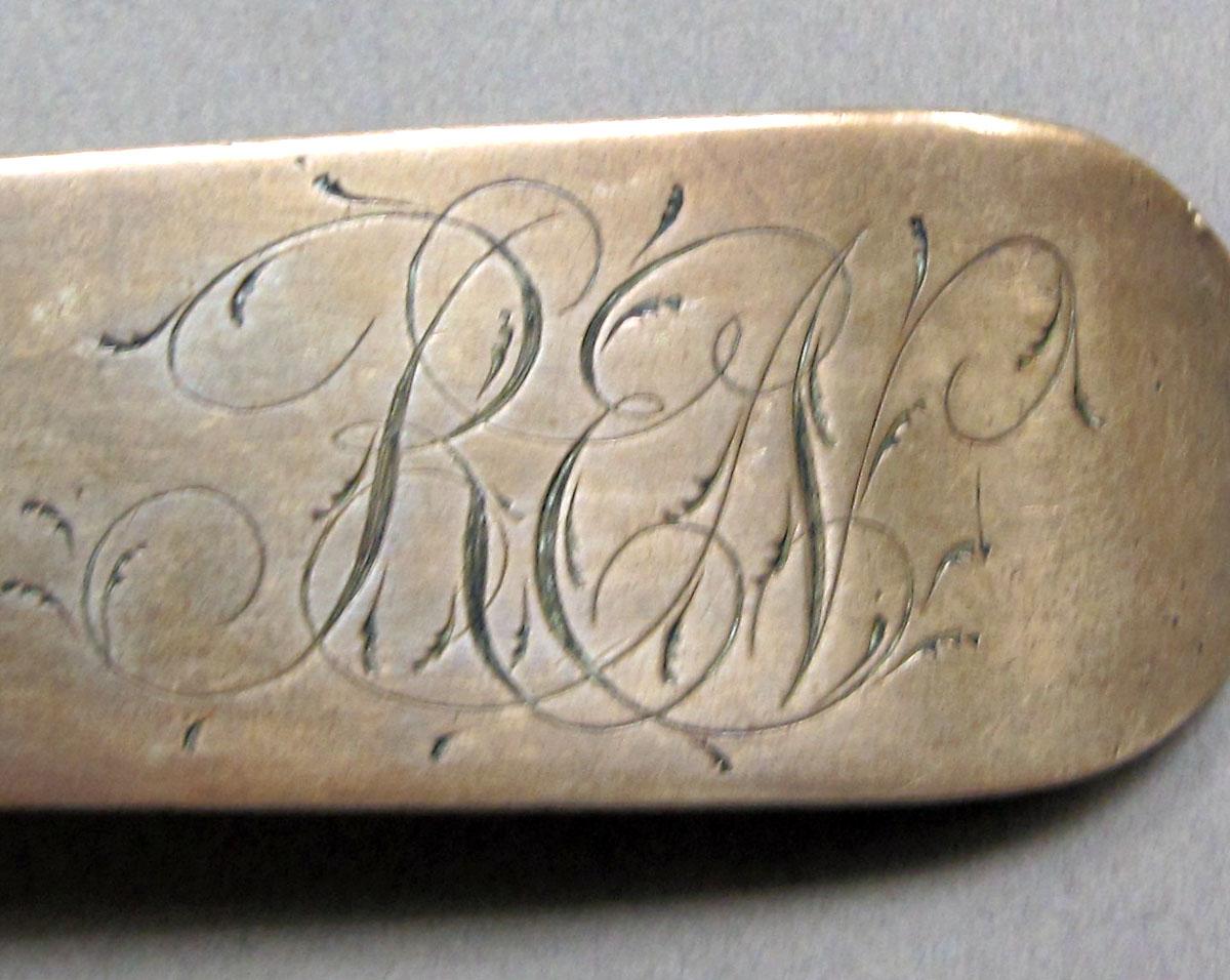 1962.0240.1498 Silver spoon engraving