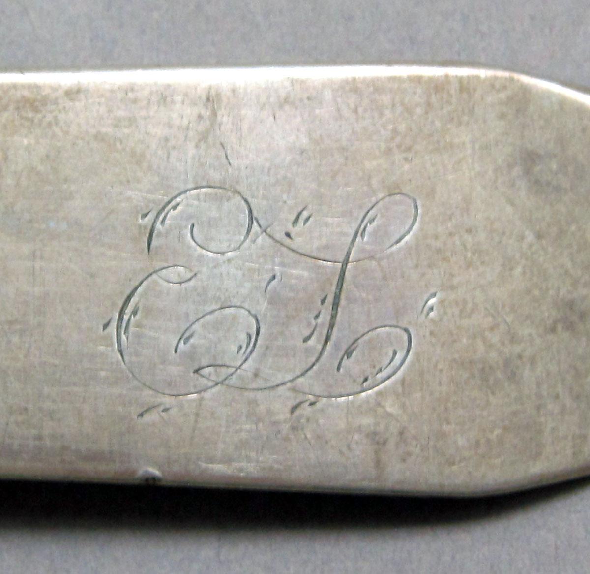 1962.0240.1509 Silver spoon engraving