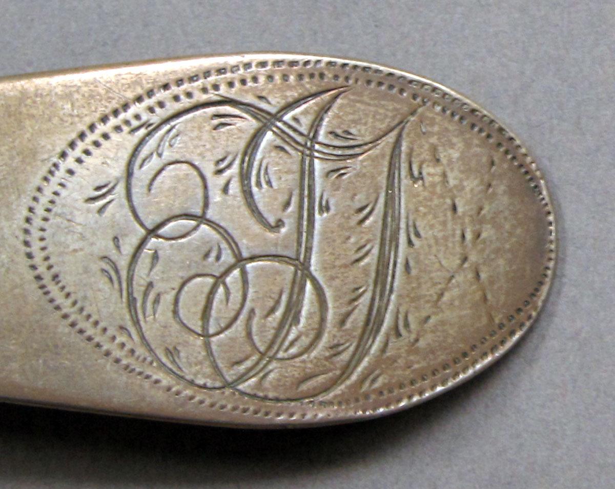 1962.0240.1512 Silver spoon engraving