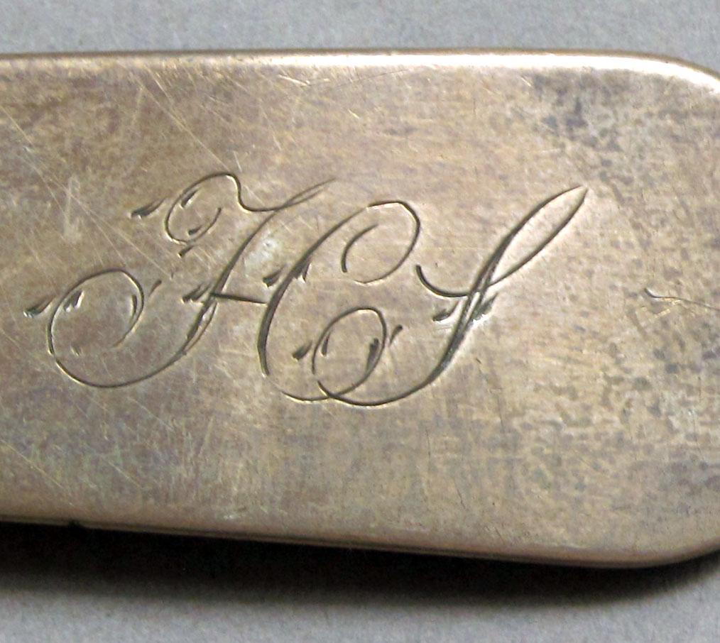 1962.0240.1517 Silver spoon engraving