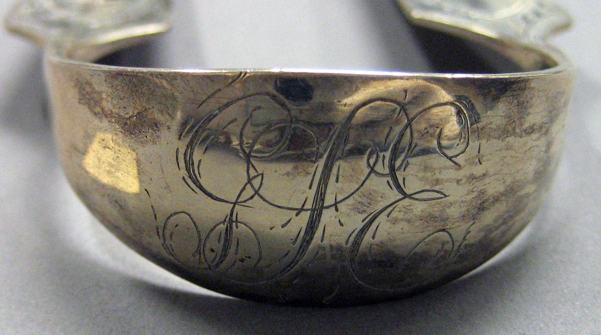 1962.0240.1627 Silver Tongs engraving