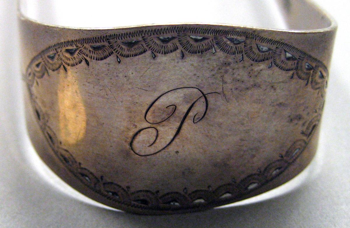 1962.0240.1630 Silver Tongs engraving