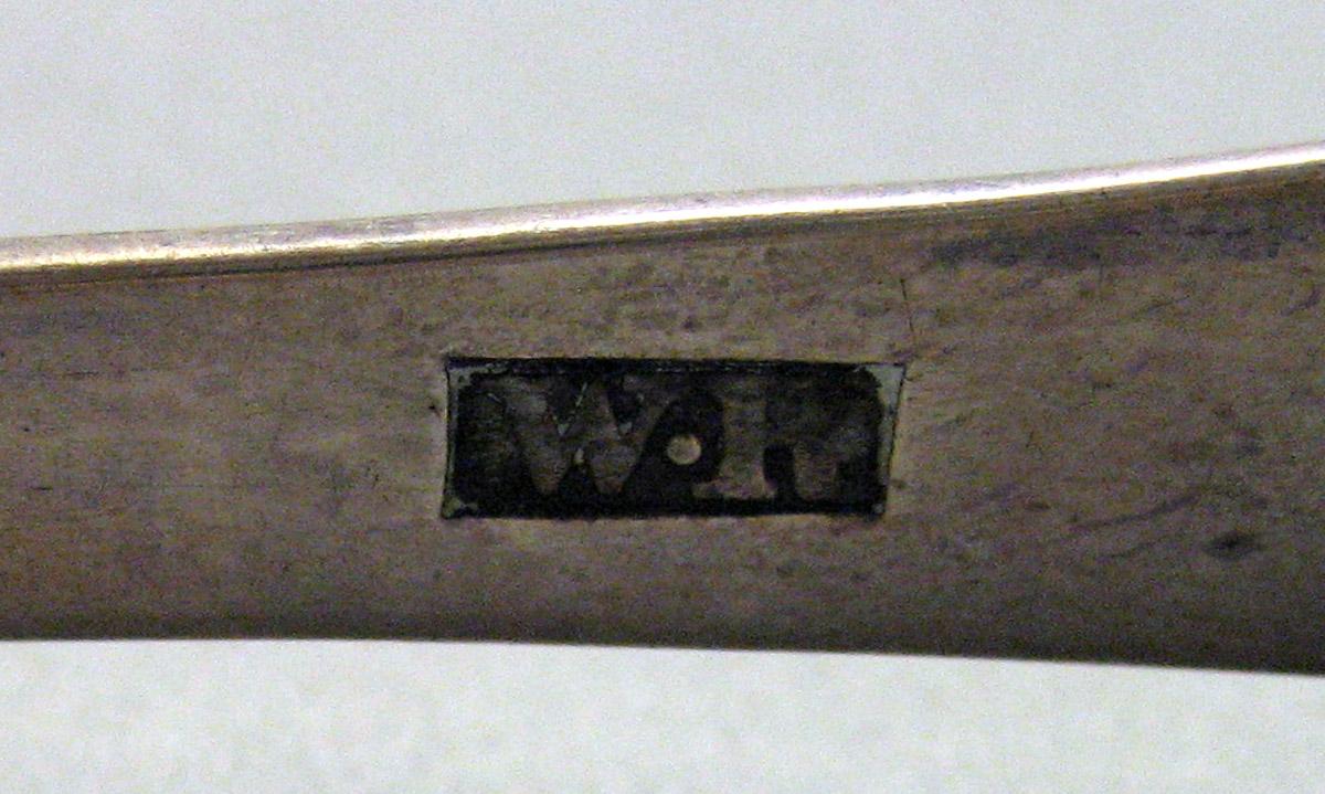 1962.0240.1630 Silver Tongs mark 1