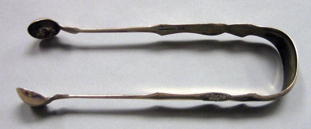 1962.0240.1642 Silver Tongs view 1