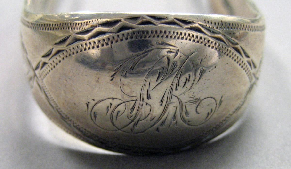 1962.0240.1655 Silver Tongs engraving