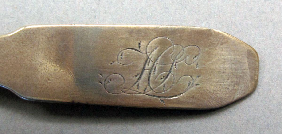 1962.0240.233 Silver spoon engraving