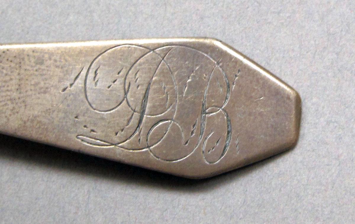 1962.0240.239 Silver spoon engraving
