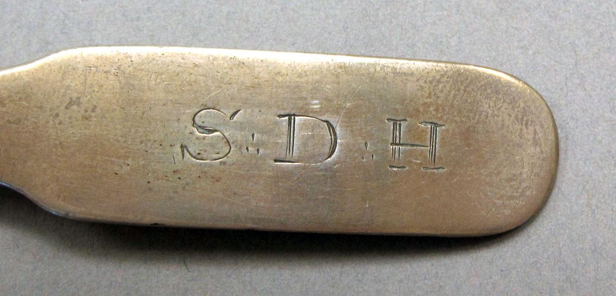 1962.0240.243 Silver spoon engraving