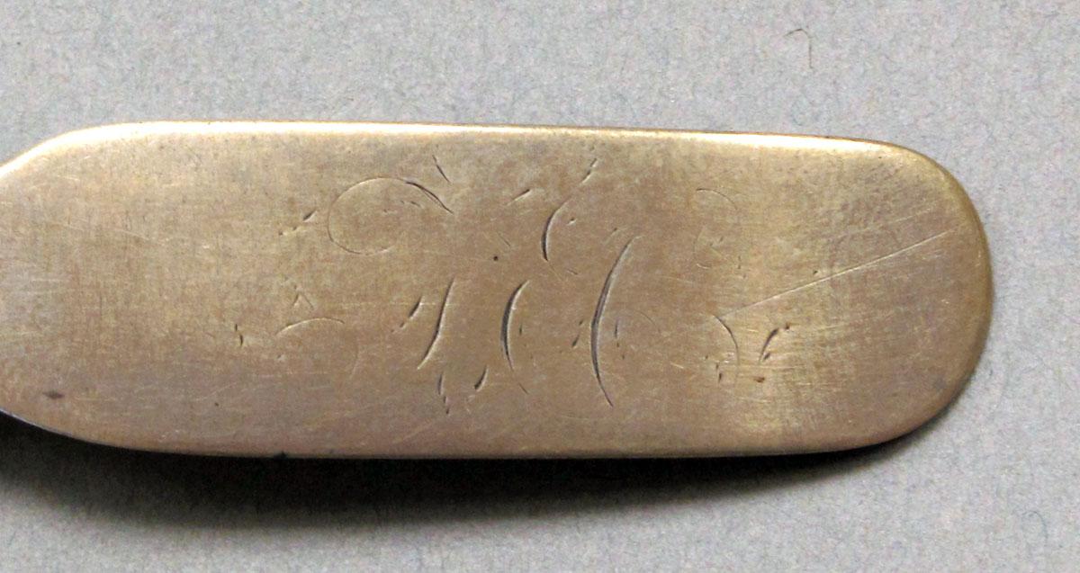 1962.0240.244 Silver spoon engraving