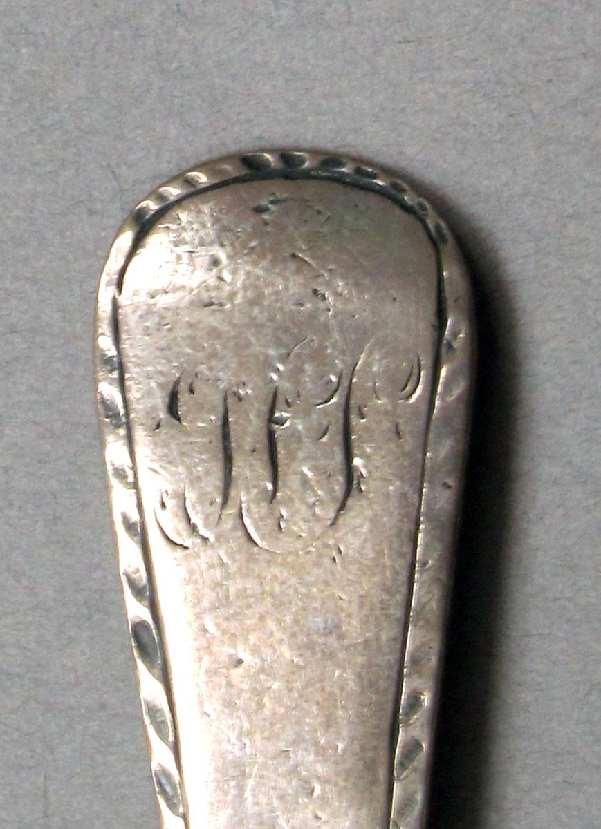 1962.0240.247 Silver spoon engraving