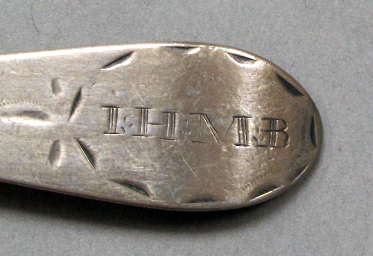 1962.0240.249 Silver spoon engraving