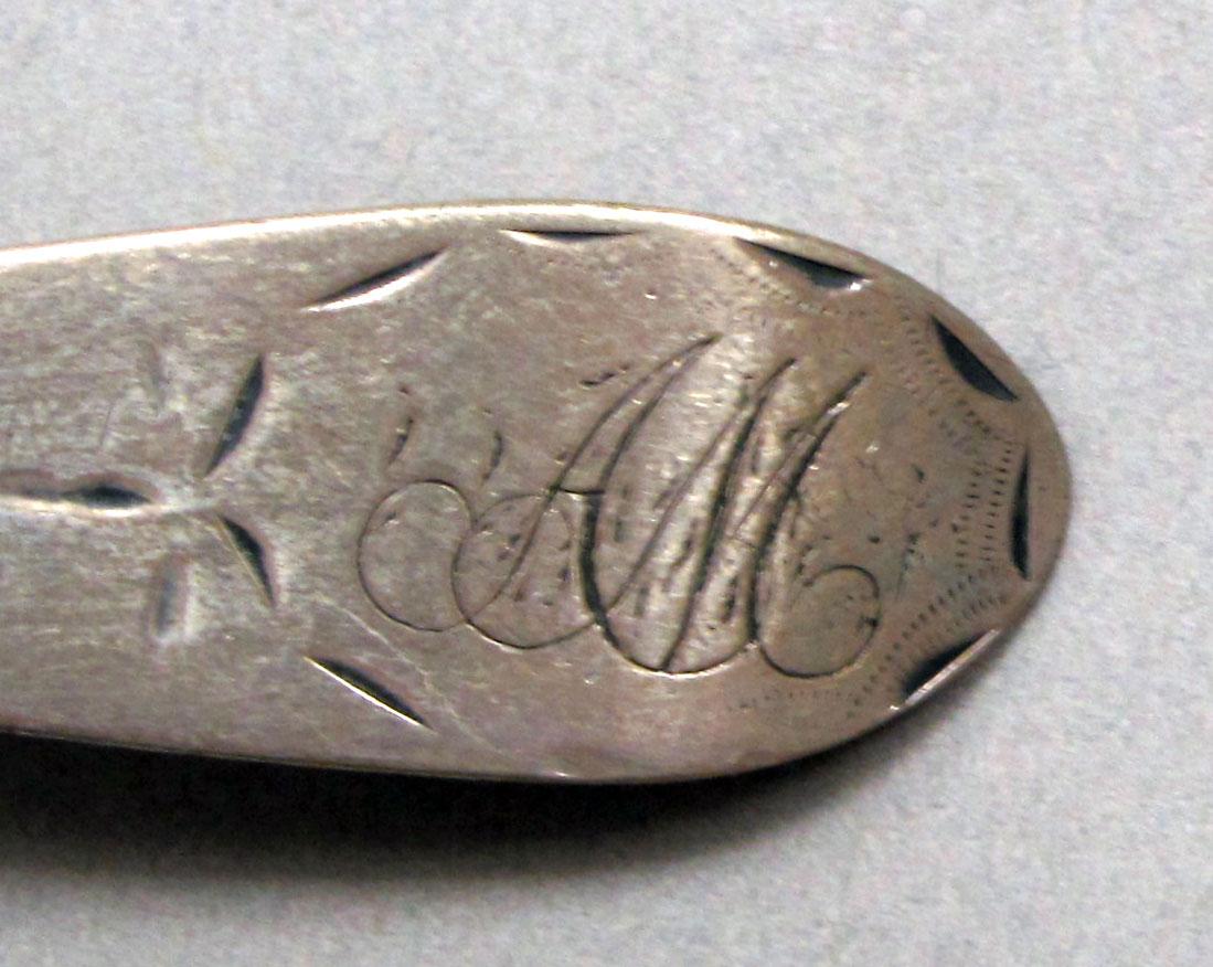 1962.0240.250 Silver spoon engraving