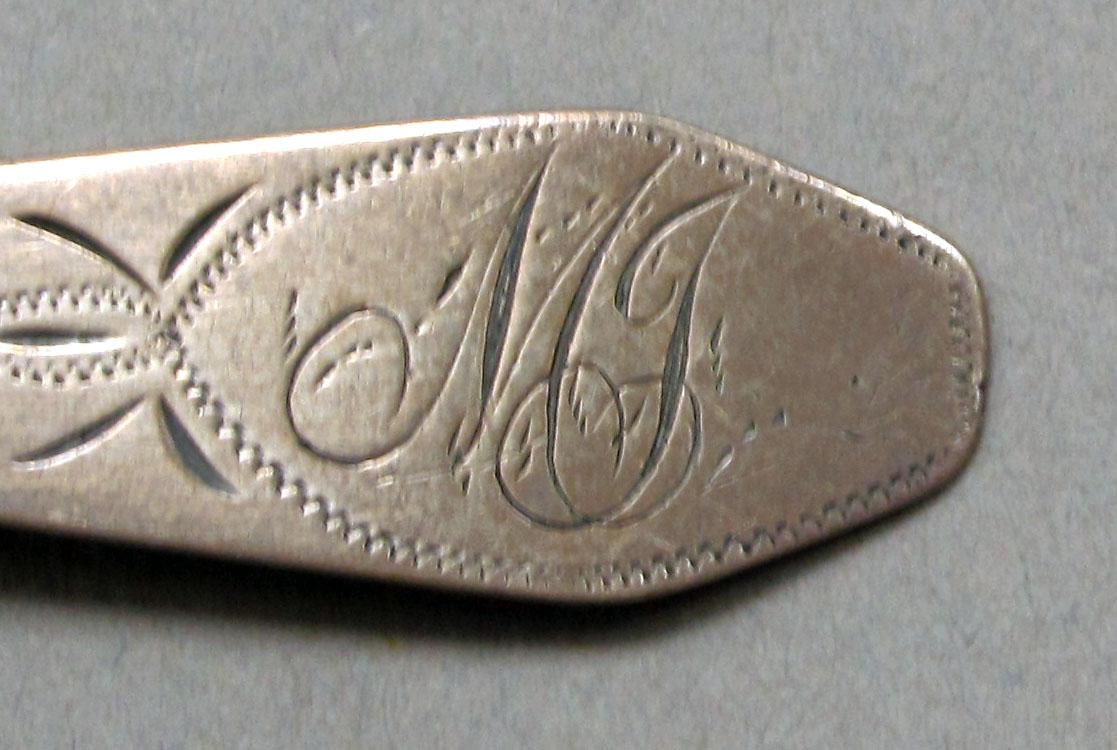 1962.0240.252 Silver spoon engraving