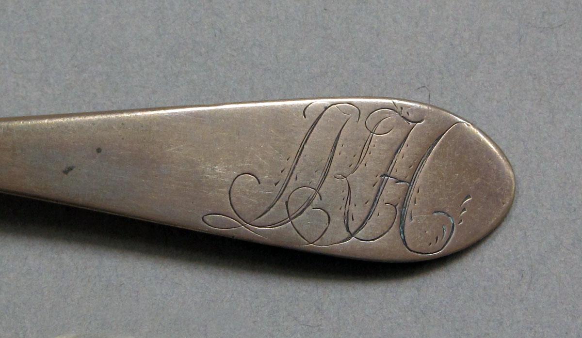 1962.0240.338 Silver spoon engraving
