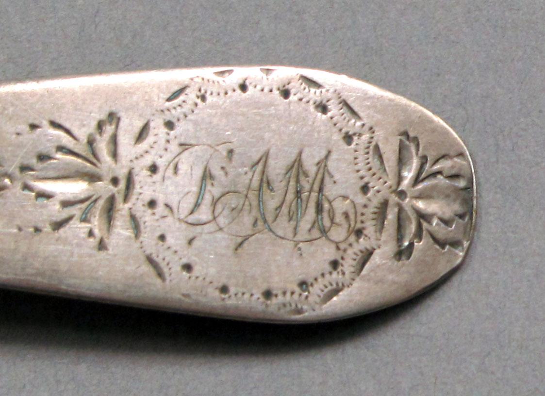 1962.0240.363 Silver spoon engraving