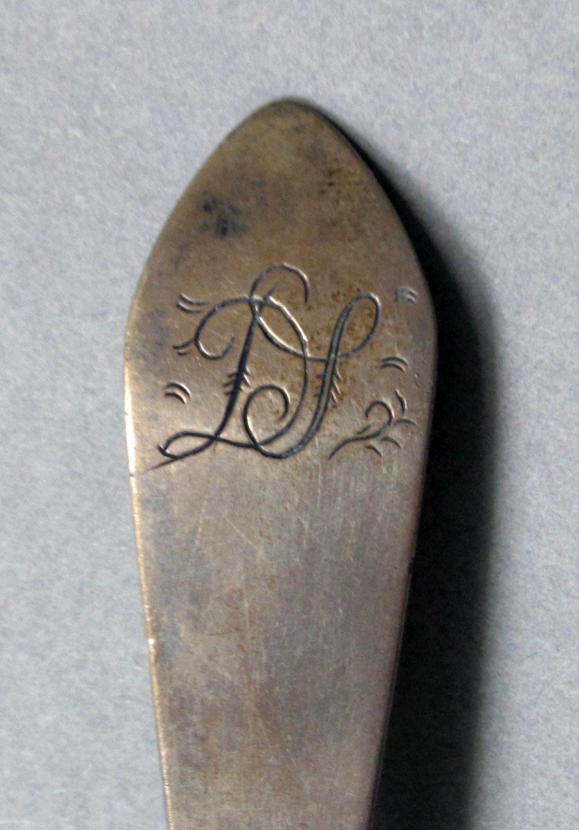 1962.0240.369 Silver spoon engraving
