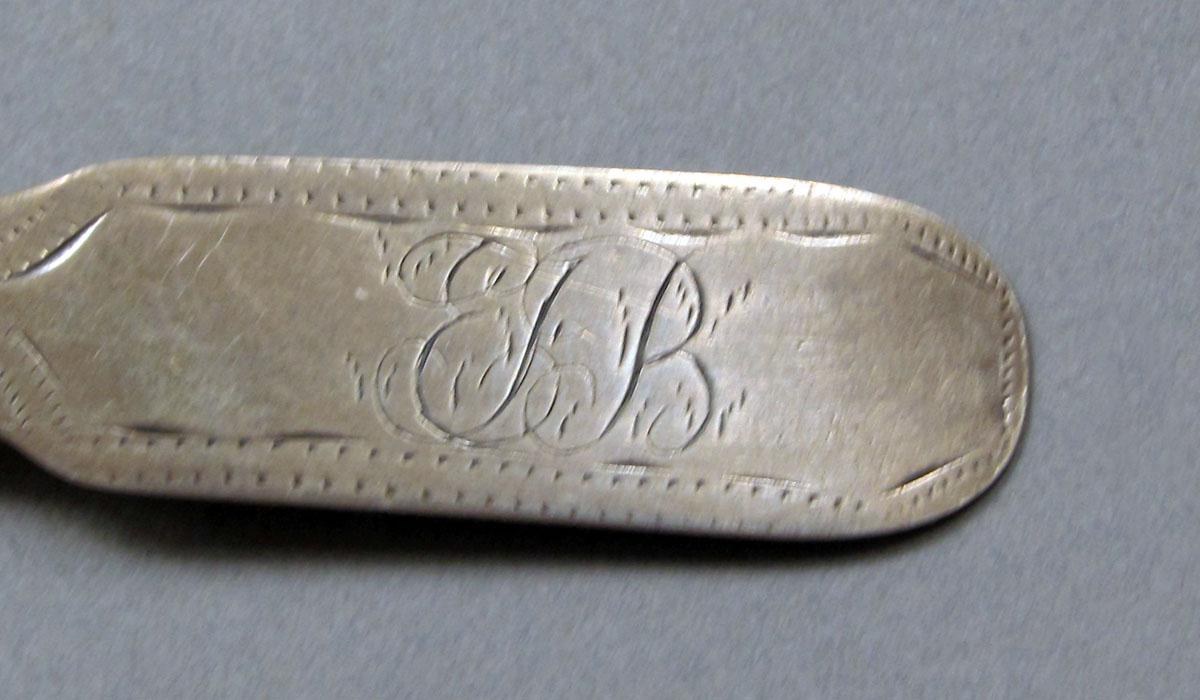 1962.0240.378 Silver spoon engraving