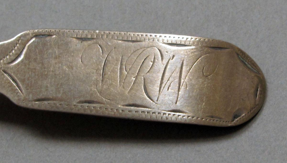 1962.0240.379 Silver spoon engraving