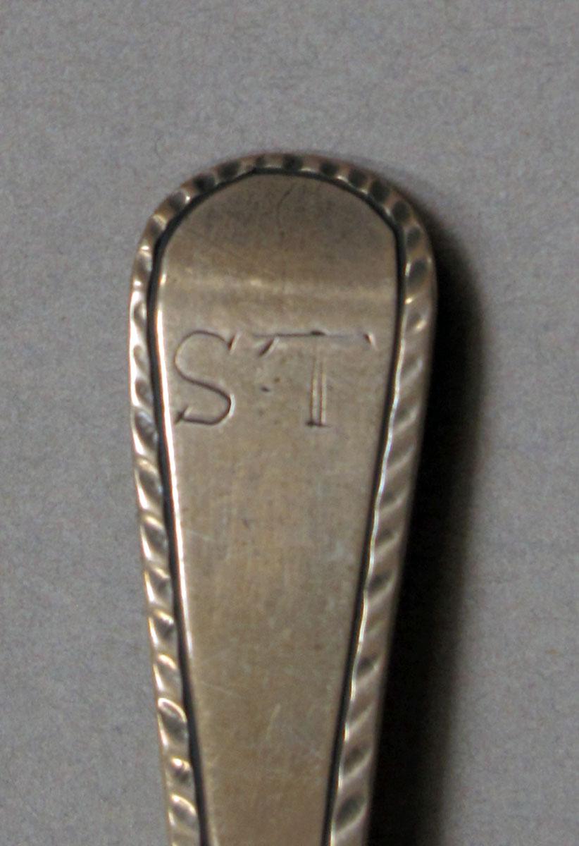 1962.0240.388 Silver spoon engraving