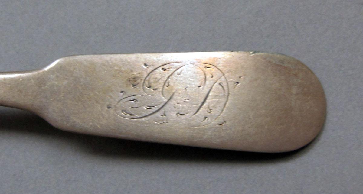 1962.0240.389 Silver spoon engraving
