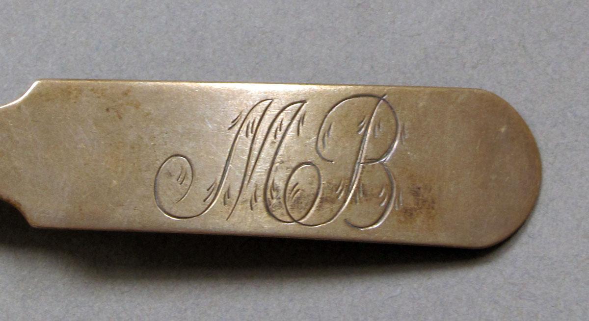 1962.0240.394 Silver spoon engraving