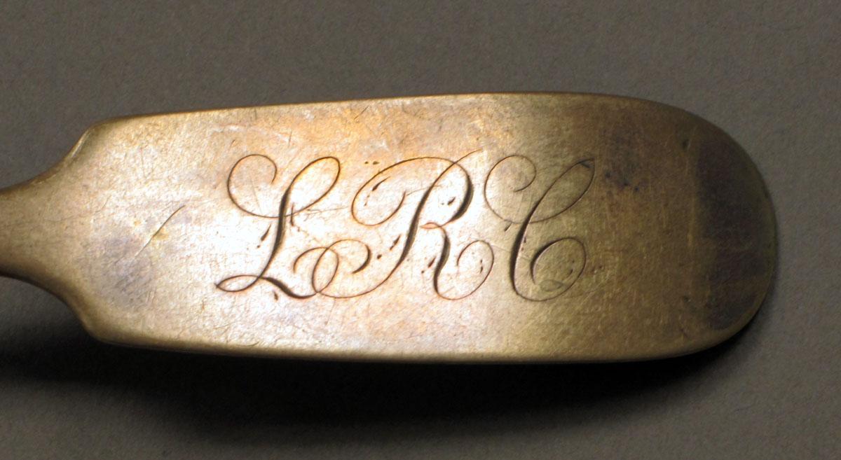 1962.0240.396 Silver spoon engraving