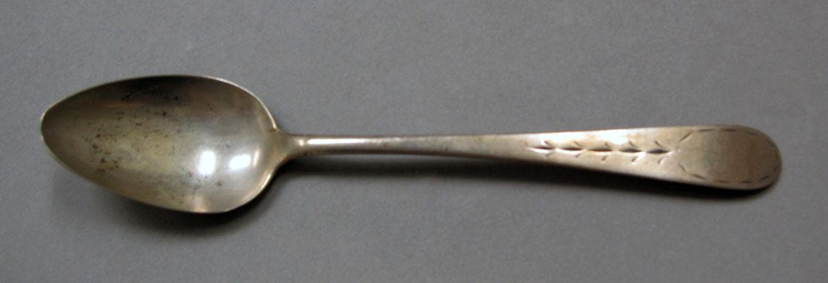 1962.0240.402 Silver spoon upper surface