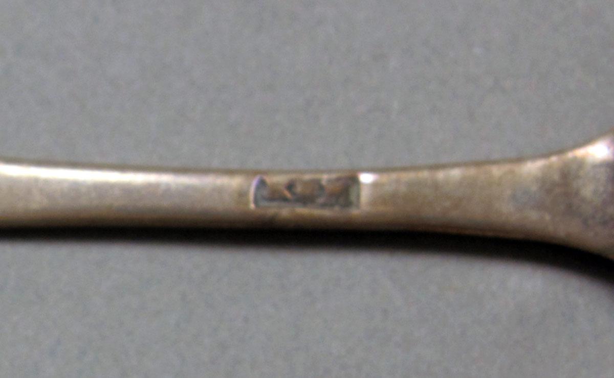 1962.0240.409 Silver spoon mark