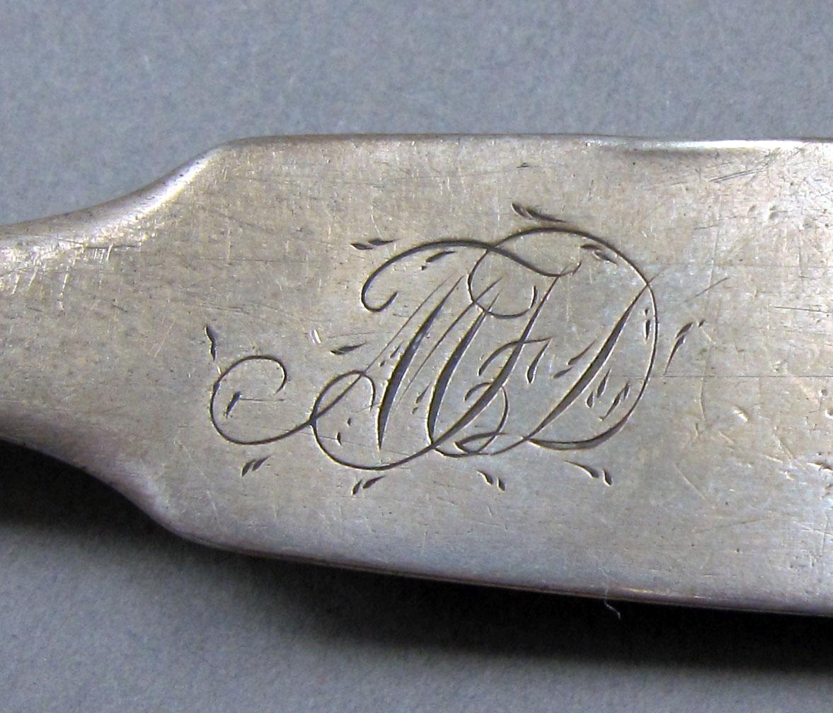 1962.0240.419 Silver spoon engraving