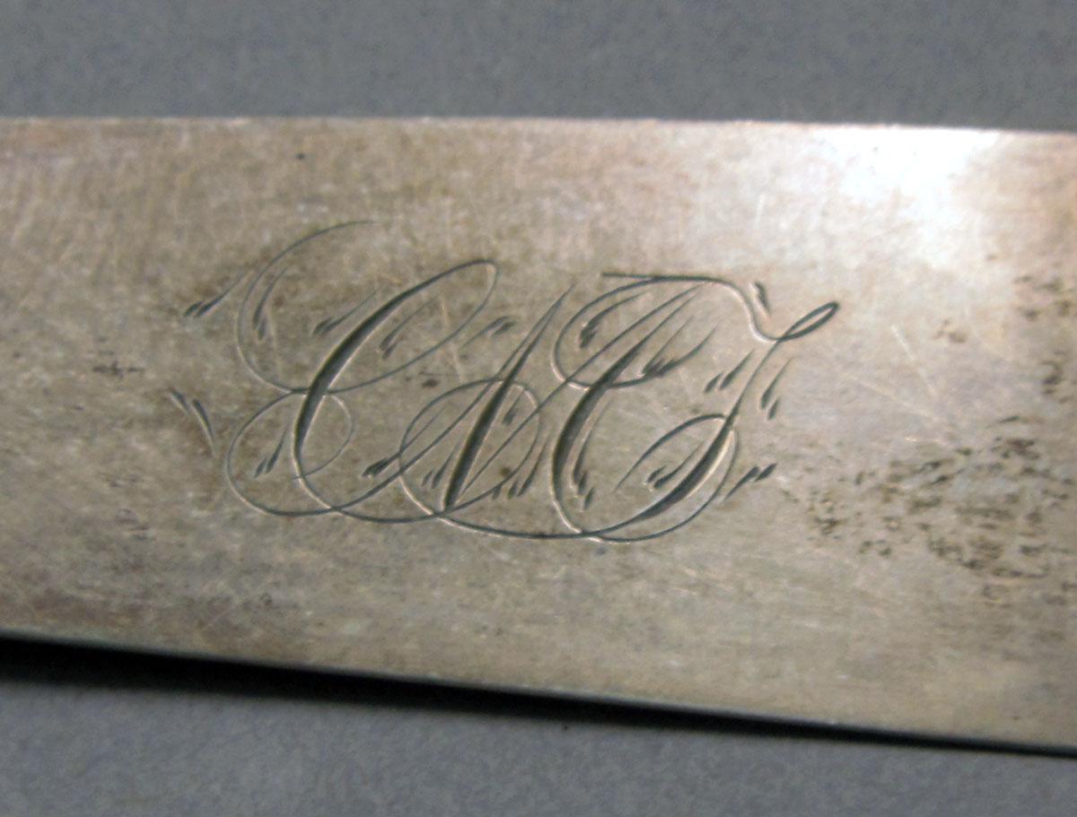 1962.0240.420 Silver spoon engraving