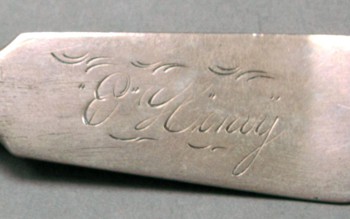 1962.0240.505 Silver sugar shovel engraving