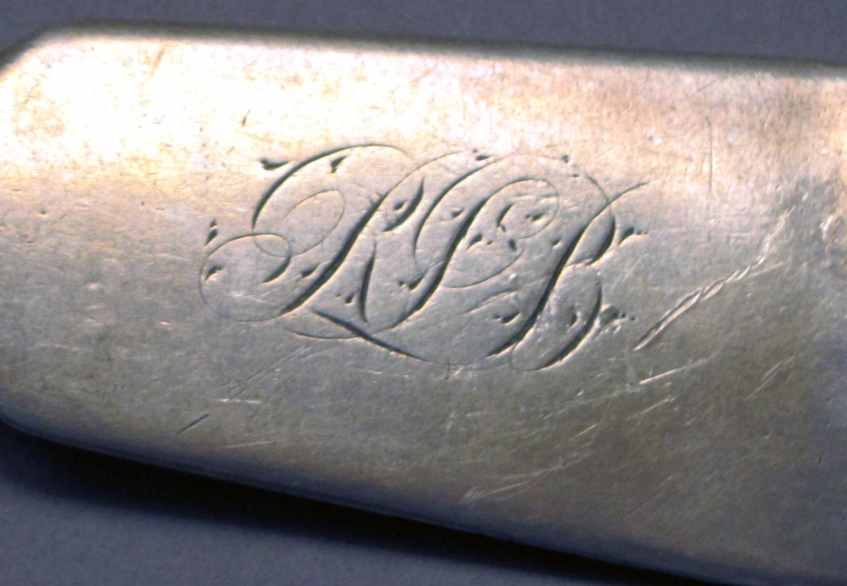 1962.0240.506 Silver fork engraving