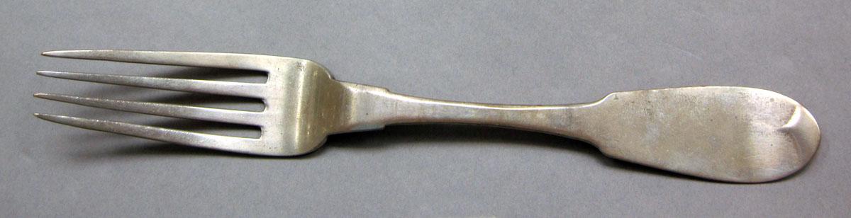 1962.0240.512 Silver fork upper surface