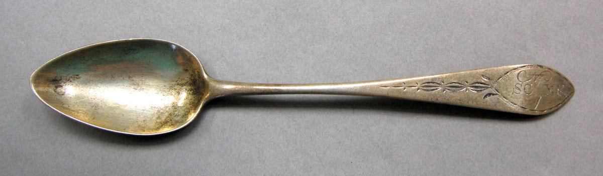 1962.0240.521 Silver spoon upper surface