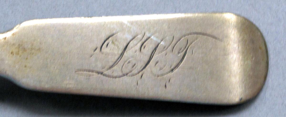 1962.0240.525 Silver spoon engraving