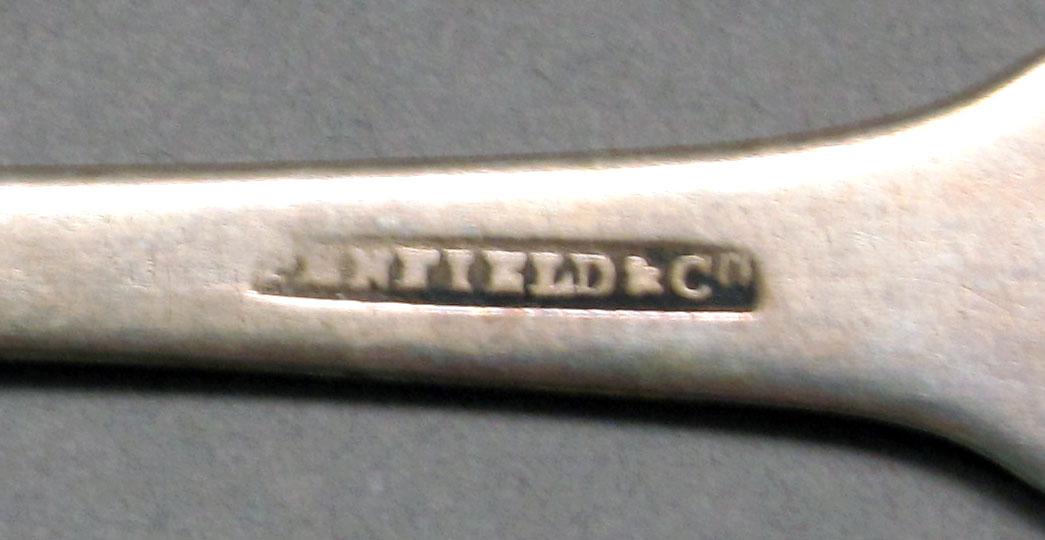 1962.0240.525 Silver spoon mark