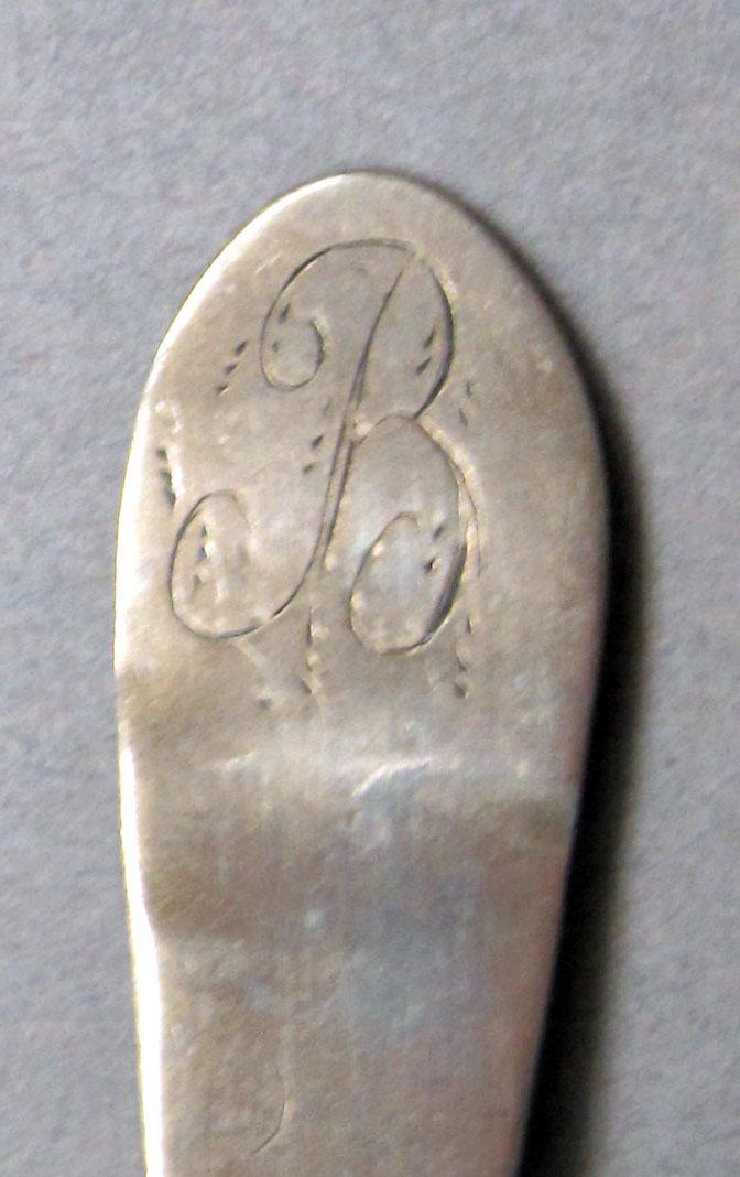 1962.0240.542 Silver spoon engraving