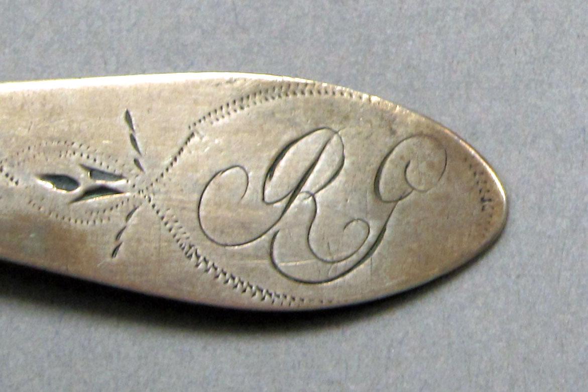 1962.0240.543 Silver spoon engraving