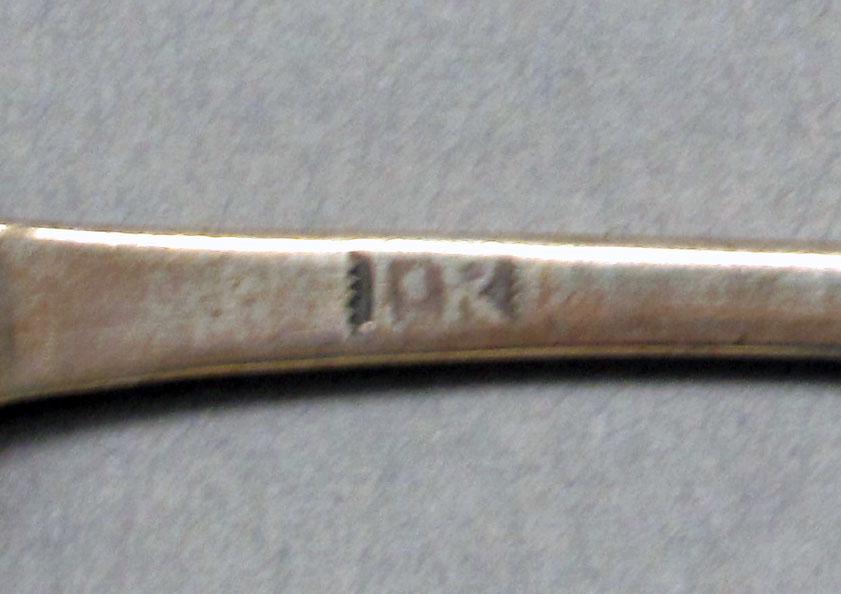 1962.0240.545 Silver spoon mark