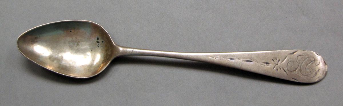 1962.0240.556 Silver spoon upper surface