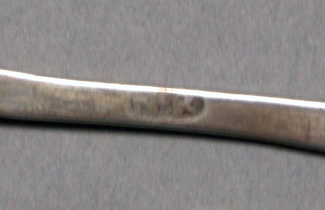 1962.0240.558 Silver spoon mark