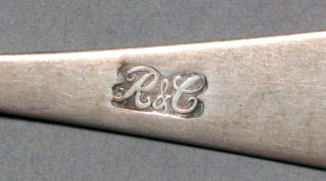 1962.0240.565 Silver spoon mark