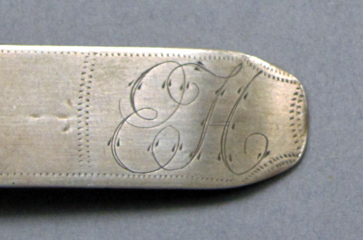 1962.0240.568 Silver spoon engraving